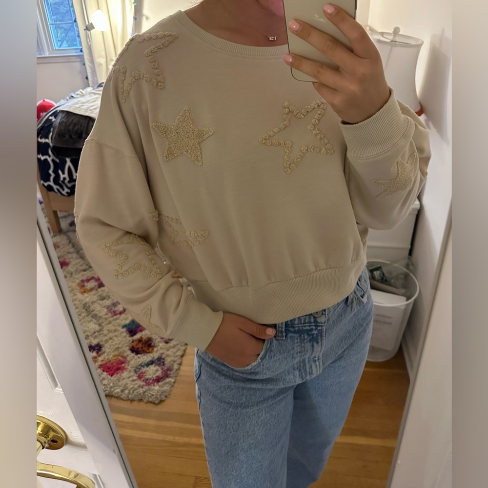 Tan sweatshirt with terry cloth stars.
